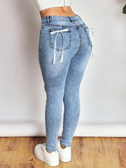 Distressed Skinny Jeans with Bow Back