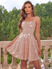 Model wearing a shimmering sequin tie back cami dress in rose gold, showcasing its flattering fit and airy design.